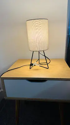 a lamp sitting on top of a wooden desk at City Central Stay in Glasgow