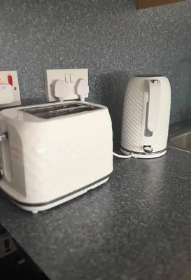 a couple of toasters sitting on a counter at City Central Stay in Glasgow