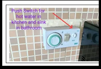 a bathroom with a soap dispenser on a wall at this flat is permenantly removed from bkngcom list in Moffat