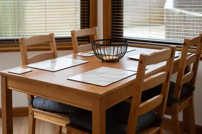 a wooden table with chairs and a basket on top at Wardlaw Retreat-WiFi-Parking in Oakley