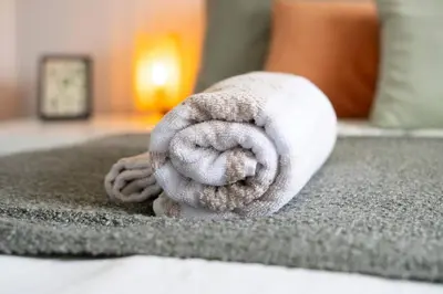 a white towel sitting on top of a bed at Wardlaw Retreat-WiFi-Parking in Oakley