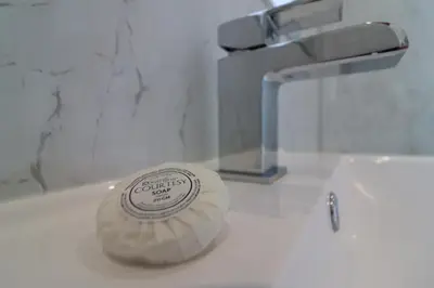 a tube of soap sitting on top of a bathroom sink at Signature - Hattrix View in Cumbernauld