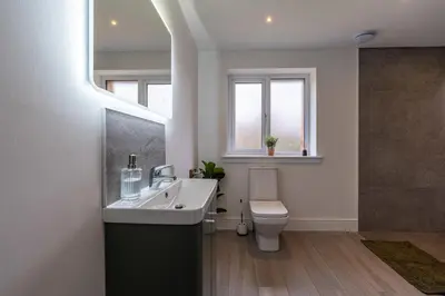 a bathroom with a sink and a toilet at Strathfillan Lodge in Crianlarich