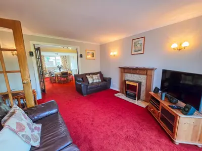 a living room with a couch and a fireplace at 3 Bedroom Home, Peaceful Garden in Edinburgh