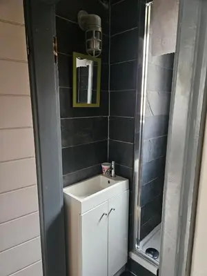 a small bathroom with a sink and a mirror at Dean Village, Edinburgh in Edinburgh