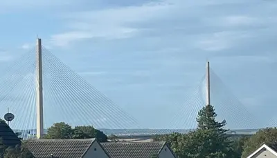 a large bridge with two towers in the sky at 3 bed self contained part house in Queensferry, Edinburgh in Queensferry