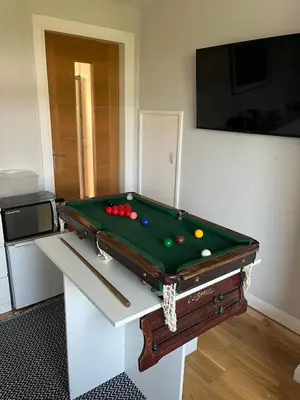 a room with a pool table with balls on it at 3 bed self contained part house in Queensferry, Edinburgh in Queensferry