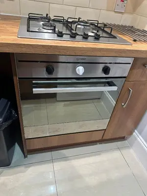 a stove top oven sitting in a kitchen at City Centre Ground floor 3 Bedroom Apartment in Edinburgh