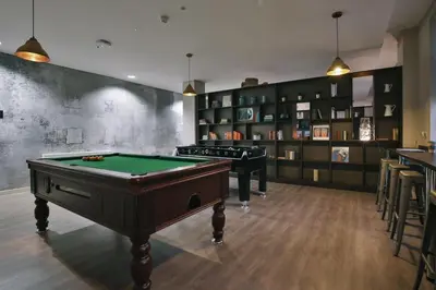 a room with two pool tables and shelves at For Students Only - Bath Street in Glasgow in Glasgow
