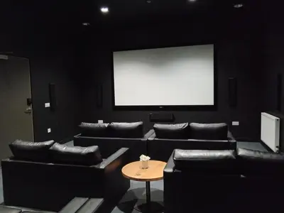 a large room with leather chairs and a white screen at For Students Only - Bath Street in Glasgow in Glasgow