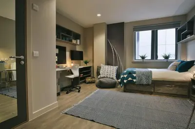 a bedroom with a bed and a desk and a window at For Students Only - Bath Street in Glasgow in Glasgow