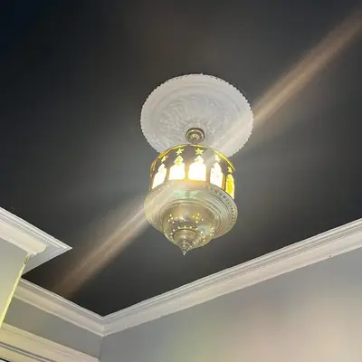 a large chandelier hanging from a ceiling at The Art Apartment in Kirn