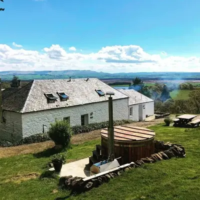 Buzzard Cottage nestled in a hillside farm