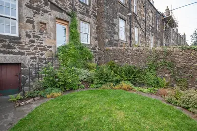 a garden in front of a brick building at Banrigh House in Stirling