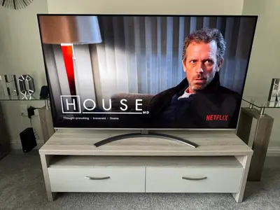 a flat screen tv sitting on top of a dresser at LUXERY 1 Bedroom Apartment - Falkirk in Falkirk