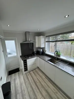 a kitchen with a sink and a stove top oven at LUXERY 1 Bedroom Apartment - Falkirk in Falkirk