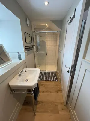 a bathroom with a sink and a shower at Kilmory Sea View in Lochgilphead