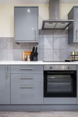 a kitchen with a stove and a white counter top at Stirlings Hidden and Tranquil Studio Apartment in Stirling