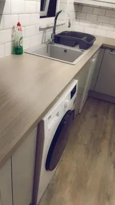 a kitchen with a sink and a counter with a sink at The friendly place in Glasgow