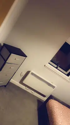 an empty room with a bed and a window at The friendly place in Glasgow