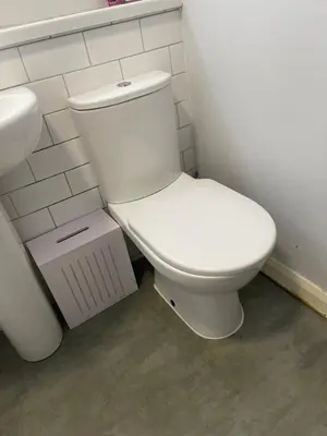 a bathroom with a white toilet and a sink at The friendly place in Glasgow