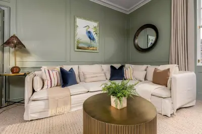 a living room with a white couch and a table at The Allan Maisonette Charming Georgian Retreat in Stirling