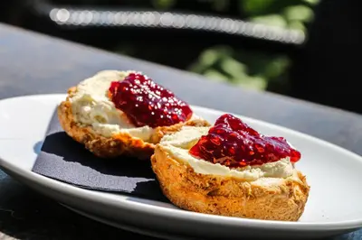 two pieces of bread with jam on a plate at Glenisle Hotel in Isle of Arran