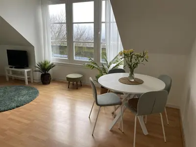 a living room with a white table and chairs at Skibo Vista Dunfermline in Dunfermline