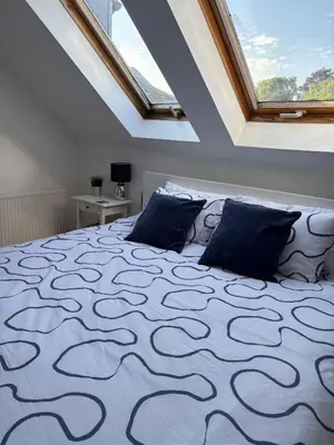 a bedroom with a bed with a roof at Skibo Vista Dunfermline in Dunfermline