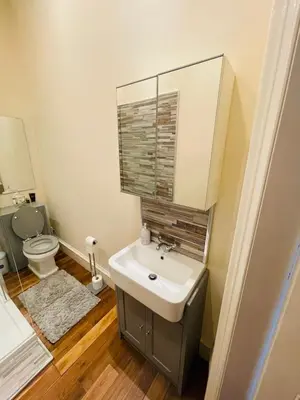 a bathroom with a sink and a toilet at Lovely 2 bedroom apartment in Ayr town centre in Ayr