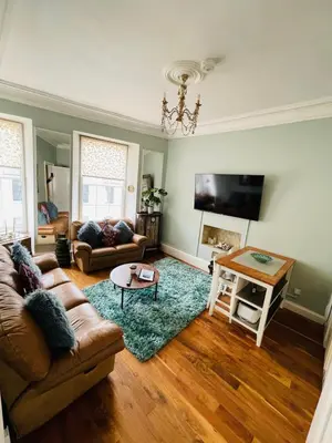 a living room with a couch and a table at Lovely 2 bedroom apartment in Ayr town centre in Ayr