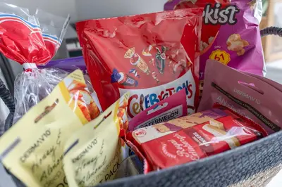 a basket filled with food and other snacks at Livingston Retreat 4bed Home Wi-Fi Parking in Uphall
