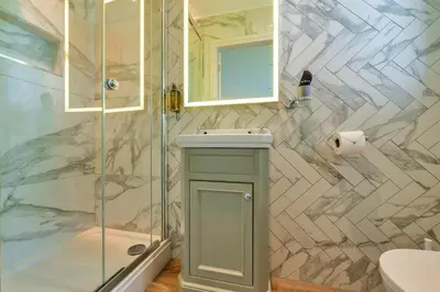 a bathroom with a shower and a sink and a toilet at Finest Retreats - Grassyards House in Largs