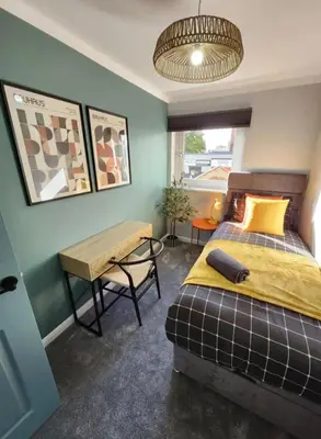 a bedroom with a bed and a desk and a table at Urban 4BR house - Central-FREE parking-NO PARTY in Glasgow