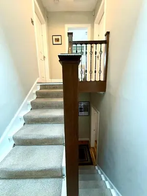 a staircase in a house with a stair case at Historic Mews House 2BR in Edinburgh City Centre in Edinburgh