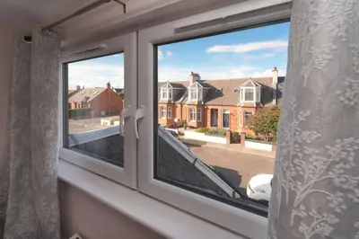 a window with a view of a street at Seabreeze in Prestwick in Prestwick