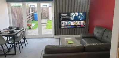a living room with a couch and a table at Oatlands Oasis-FREE PARKING-2 Minutes from M74 in Glasgow