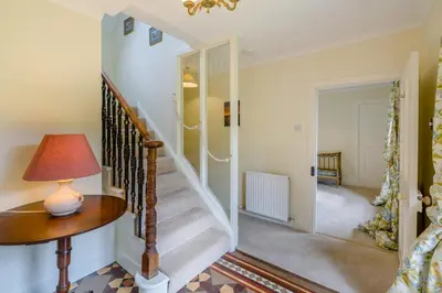 a staircase in a home with a lamp on a table at 3 Bed in Comrie oc-e33307 in Comrie