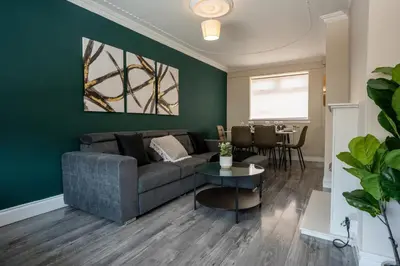 a living room with a couch and a table at 2 BDR House At Caledonia Luxe Stays Short Lets & Serviced Accommodation Hamilton in Hamilton
