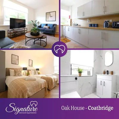 a kitchen and a living room with white cabinets at Signature - Oak House in Coatbridge