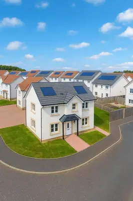 a row of houses with solar panels on their roofs at 3BR Detached Home, Driveway & Large Rear Garden in Hogganfield