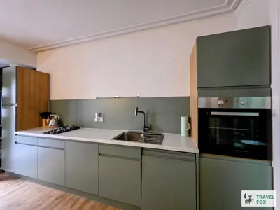 a kitchen with a sink and a stove at High Street Stay - Oban in Oban