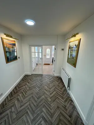 an empty hallway with a stairway with aoice at Fairholme Gardens House in Moffat