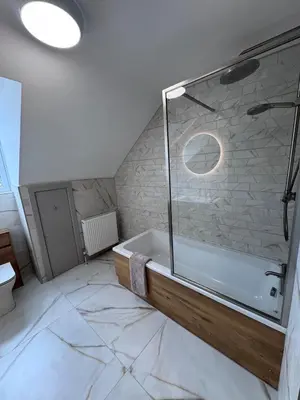 a bathroom with a shower and a bath tub at Abhaille Chluaidh - Macaulay Letting in Helensburgh