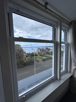 a window with a view of a street at Abhaille Chluaidh - Macaulay Letting in Helensburgh