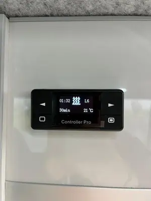 a digital clock on the side of a refrigerator at Campervan Scotland, Glen Roamer in Braco