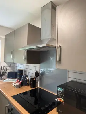 a kitchen with a stove top oven and a microwave at Seaside Escape 101 Nelson Largs in Largs