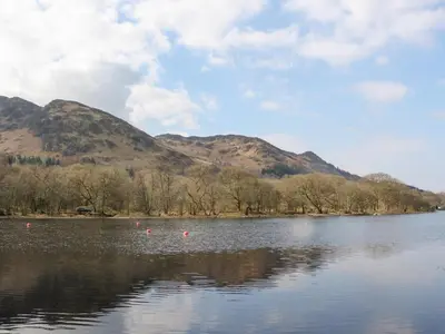 a view of a lake with mountains in the background at Altair Lodge in Crieff