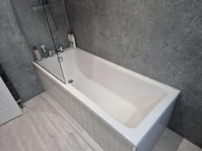 a white bath tub in a gray bathroom at Seafield Crt, North Shore Beach in Horse Isle