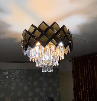 a chandelier hanging from the ceiling in a room at Likewise Modern Two bedrooms Home for 4 in Glasgow Area in Pollokshaws